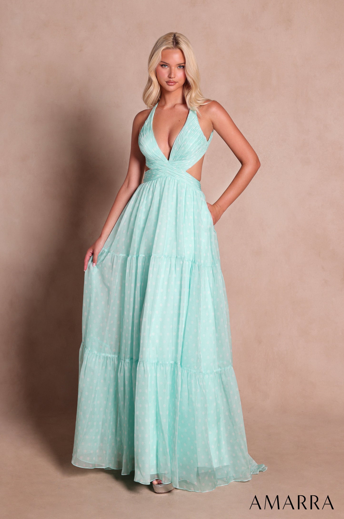 Amarra style 89730 long mint green polka dot dress with subtle white dots, plunging halter neckline, cutout sides and three-tiered a-line skirt, front view